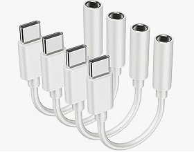 A set of white USB-C to audio jack adapters, designed for connecting devices to headphones or speakers.