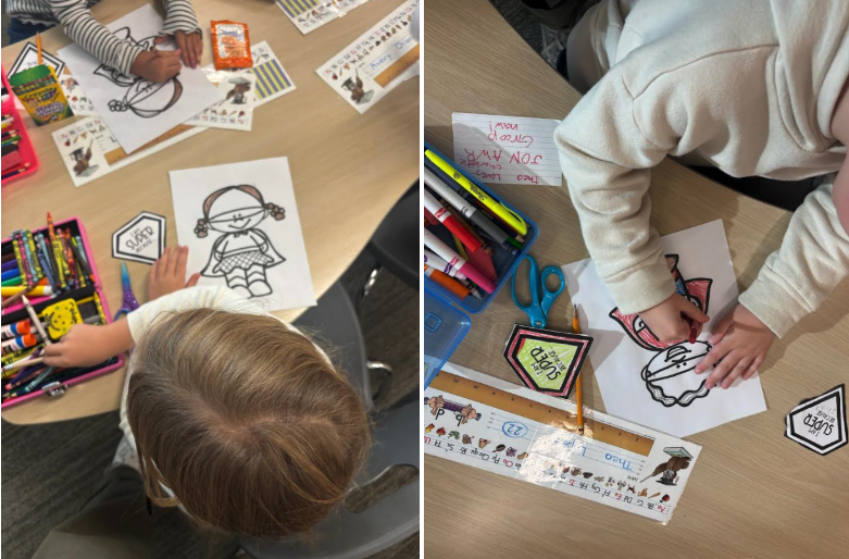 Children coloring on a table with markers, crayons, and printed character outlines in a classroom setting.