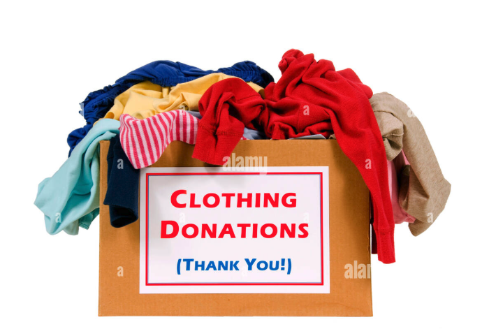 A cardboard box overflowing with colorful clothing, labeled "Clothing Donations (Thank You!)".